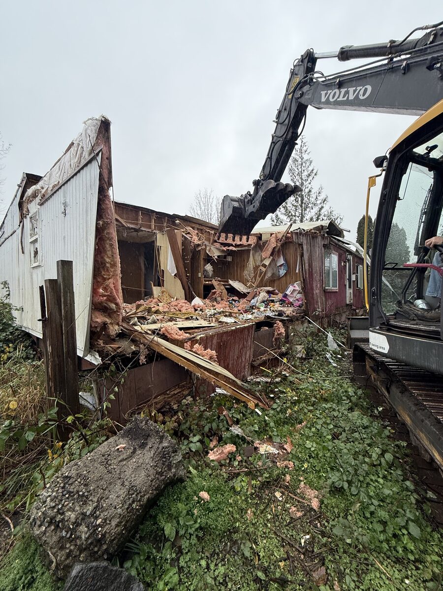 Volvo excavator demolishing a structure